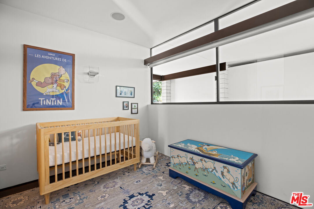 12321 Rochedale Lane Los Angeles, CA 90049 - Photo 34 of 46 a bedroom with furniture and a window