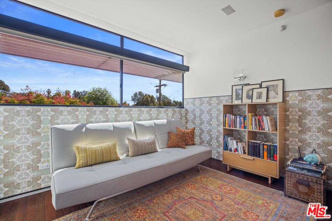12321 Rochedale Lane Los Angeles, CA 90049 - Photo 37 of 46 a living room with furniture and a rug
