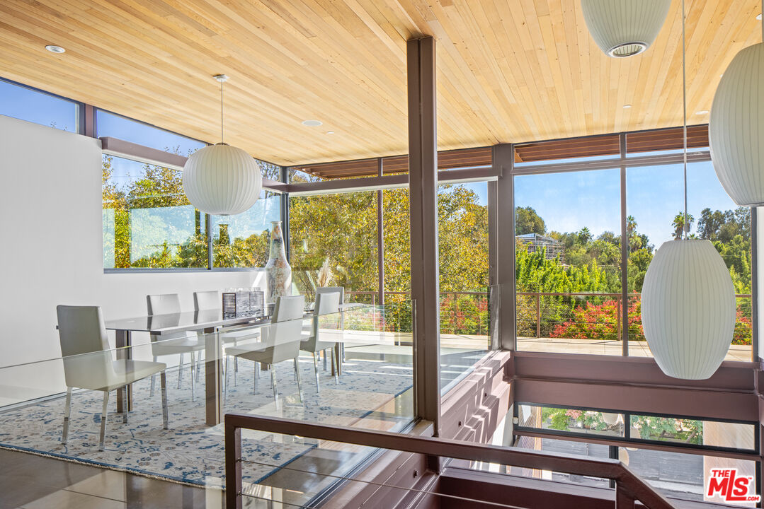 12321 Rochedale Lane Los Angeles, CA 90049 - Photo 5 of 46 a view of a living room with furniture and a window