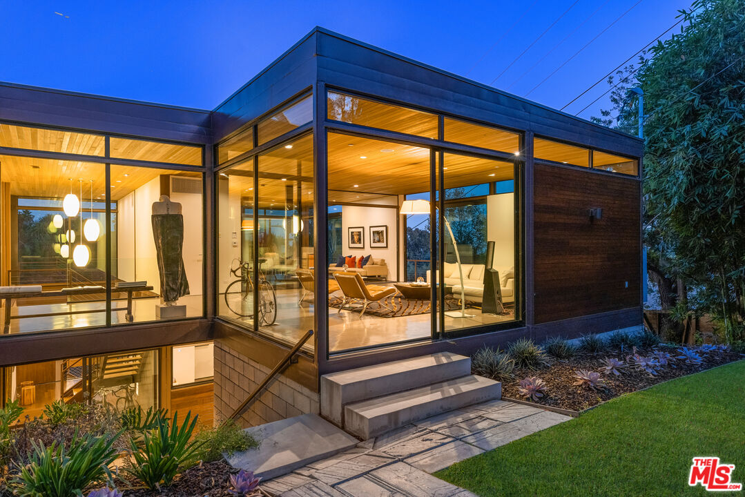 12321 Rochedale Lane Los Angeles, CA 90049 - Photo 45 of 46 a front view of a house with a garden