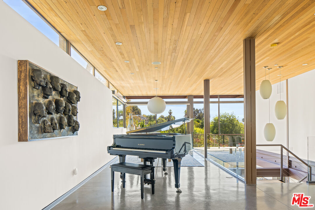 12321 Rochedale Lane Los Angeles, CA 90049 - Photo 6 of 46 a view of furniture and floor to ceiling window