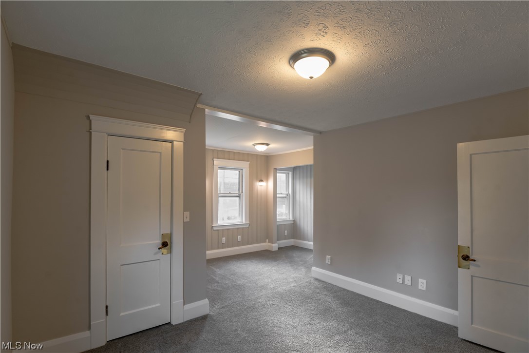 170 Avon Belden Road Avon Lake, OH 44012 - Photo 7 of 18 Bedroom featuring a textured ceiling and dark colored carpet