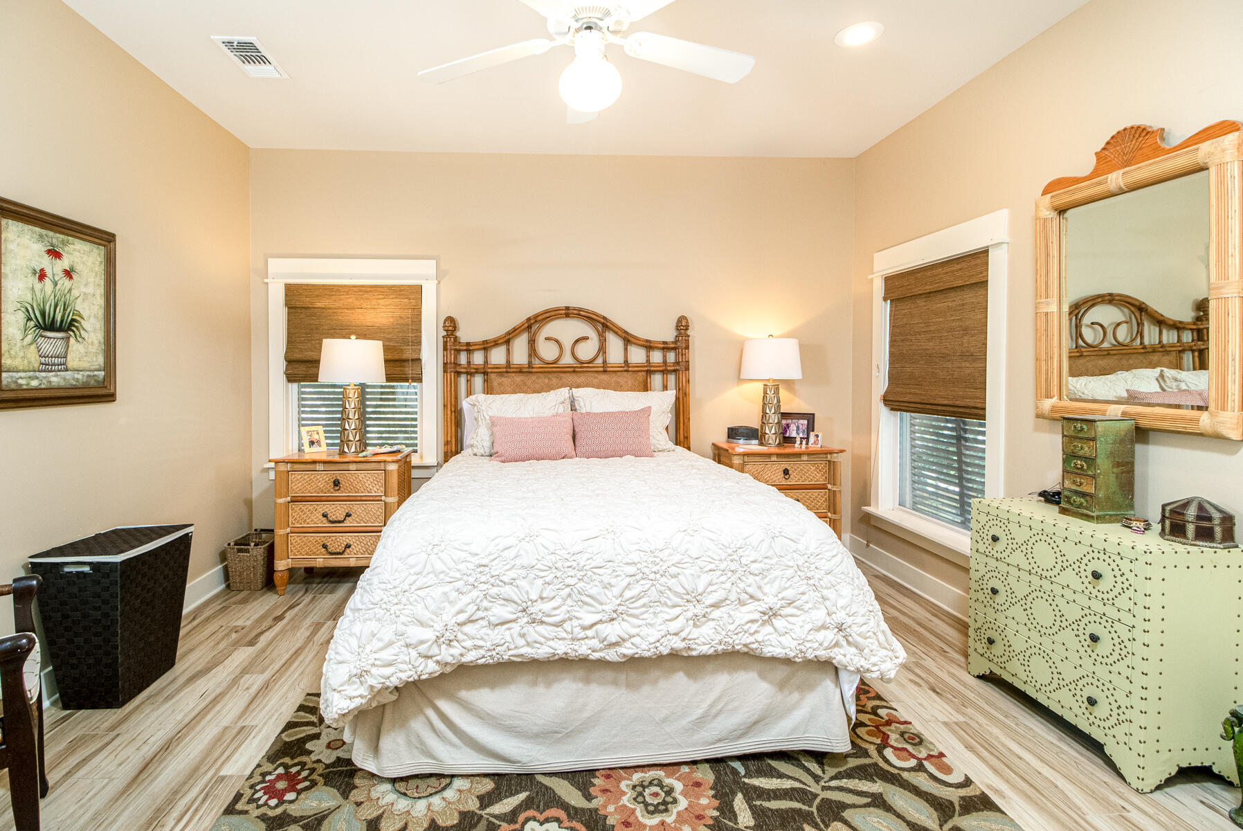 244 Baird Road Santa Rosa Beach, FL 32459 - Photo 47 of 63 a spacious bedroom with a bed and wooden floor