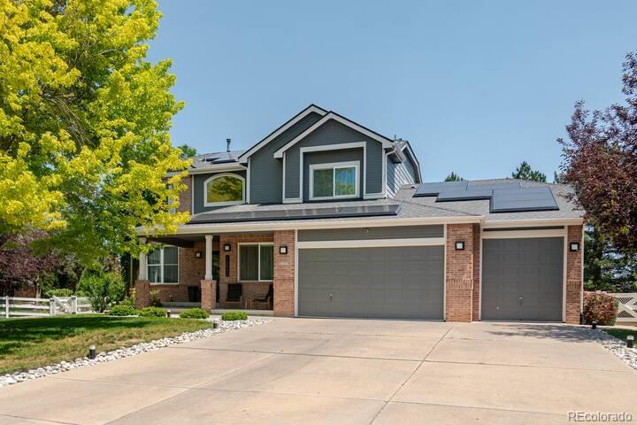 14532 Inca Court Westminster, CO 80023 - Photo 1 of 35 a front view of a house with a yard and garage