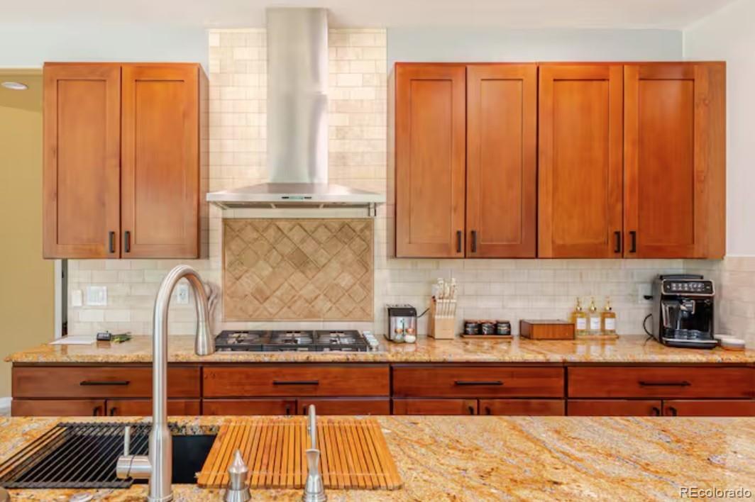 14532 Inca Court Westminster, CO 80023 - Photo 13 of 35 a kitchen with stainless steel appliances granite countertop a stove a sink and a microwave
