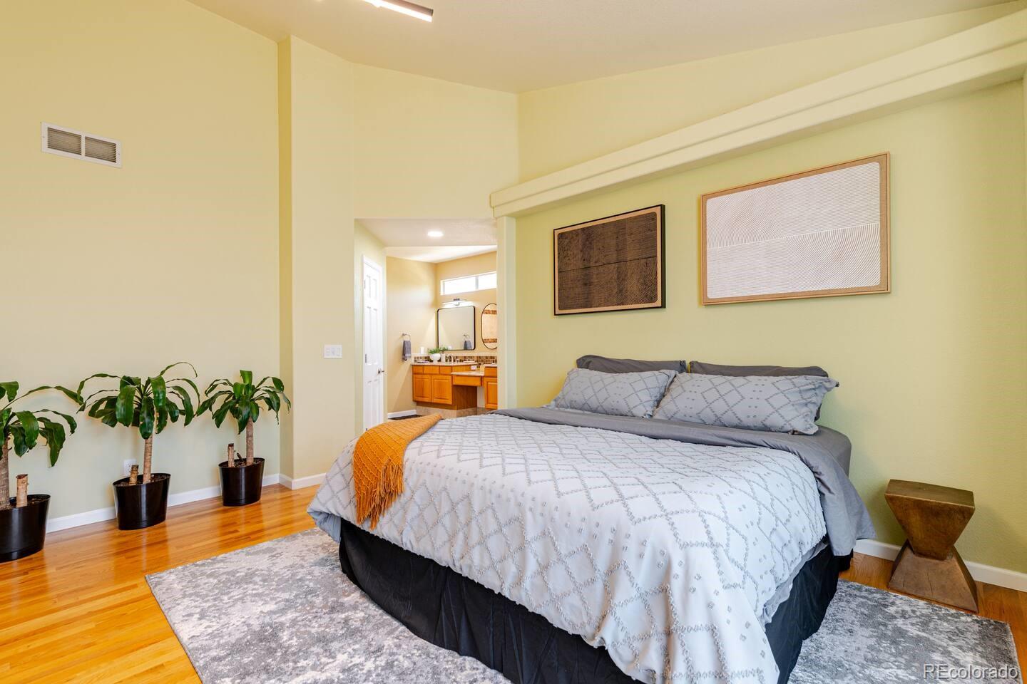 14532 Inca Court Westminster, CO 80023 - Photo 15 of 35 a bedroom with bed and a potted plant