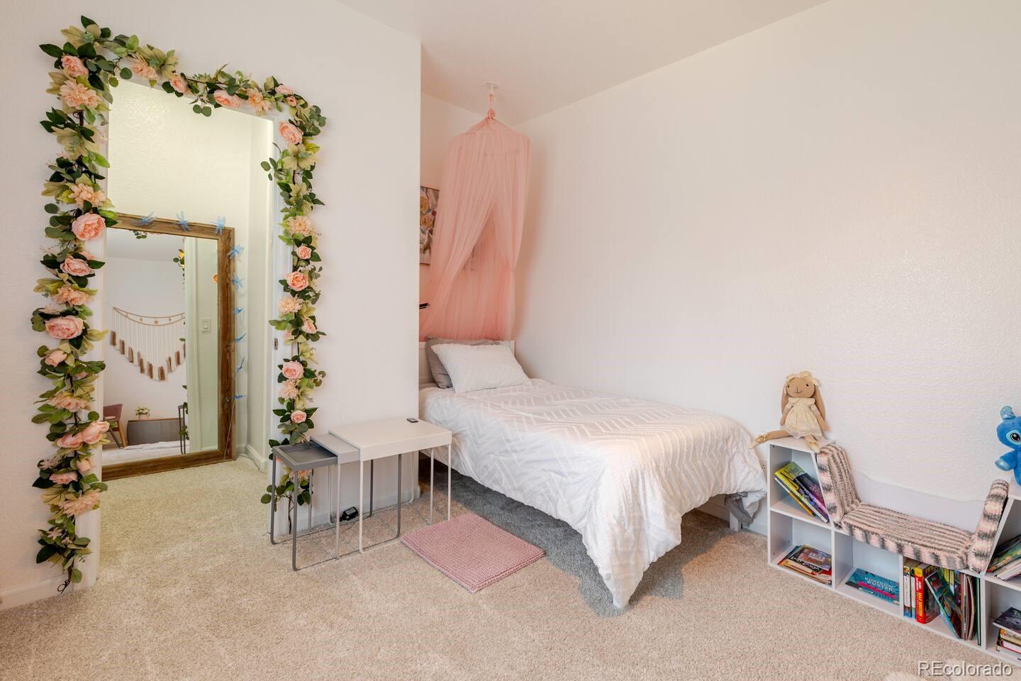 14532 Inca Court Westminster, CO 80023 - Photo 20 of 35 a bedroom with a bed and a potted plant