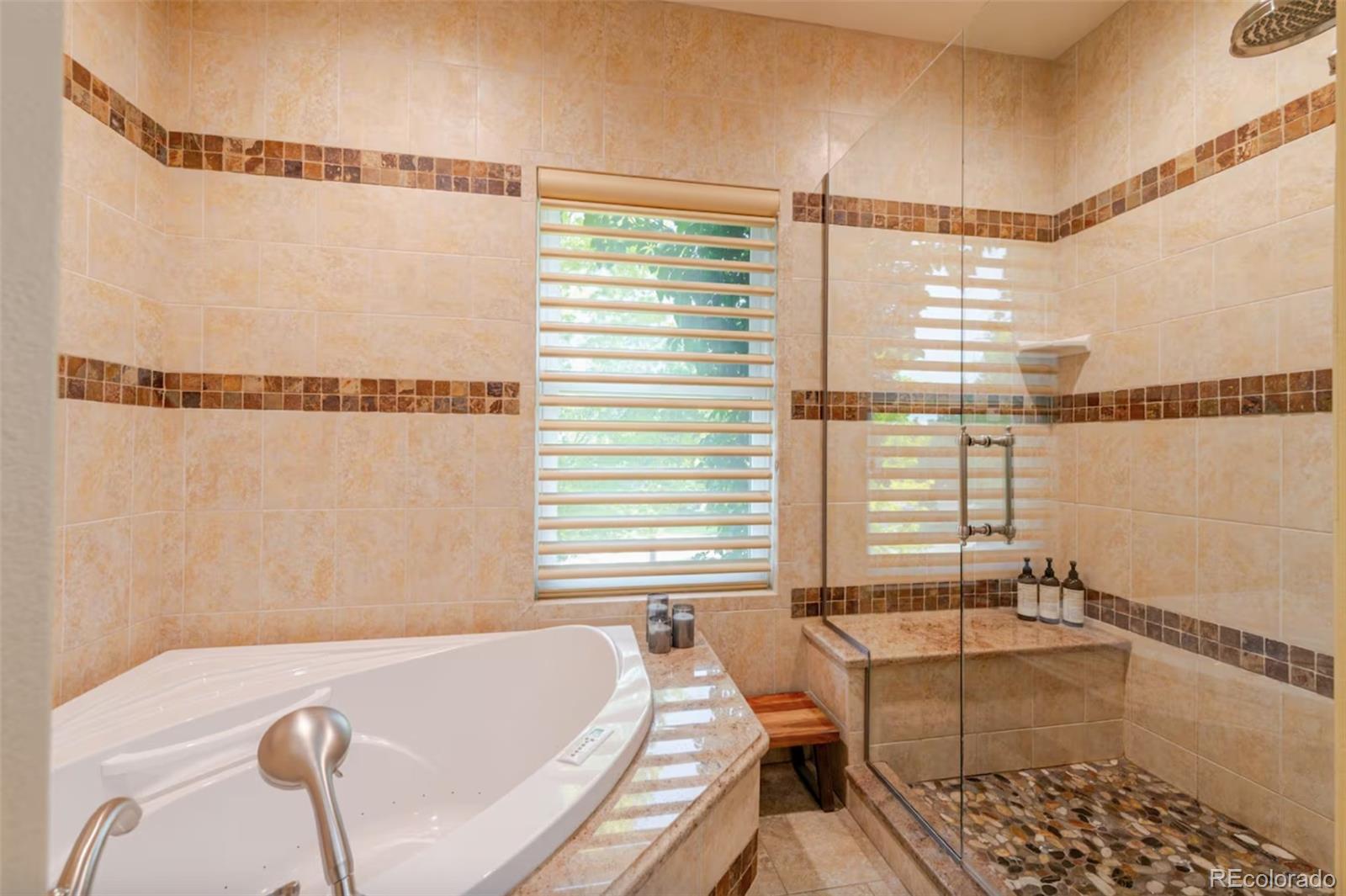 14532 Inca Court Westminster, CO 80023 - Photo 25 of 35 a bathroom with a tub and a shower