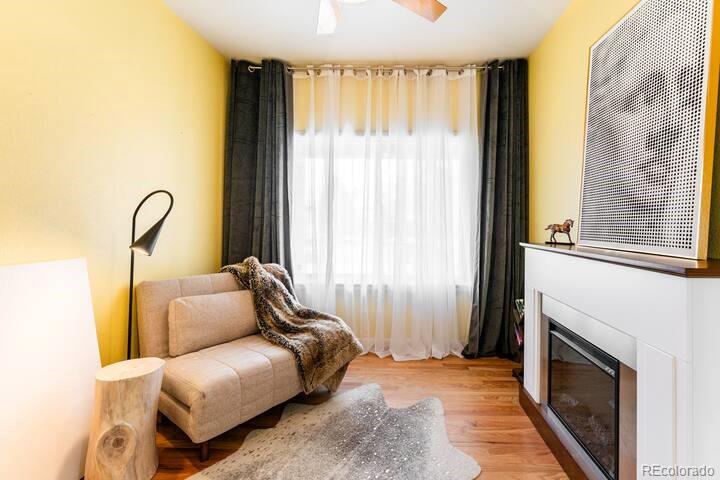 14532 Inca Court Westminster, CO 80023 - Photo 27 of 35 a bedroom with furniture and a fireplace