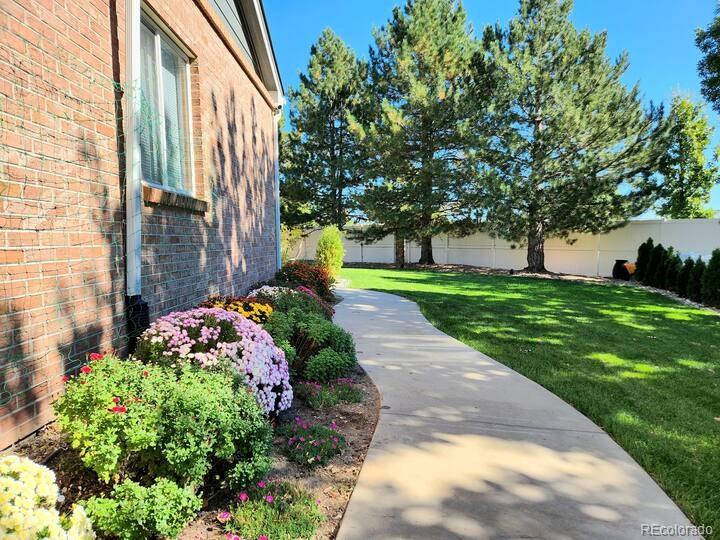 14532 Inca Court Westminster, CO 80023 - Photo 34 of 35 a view of a garden with pathway