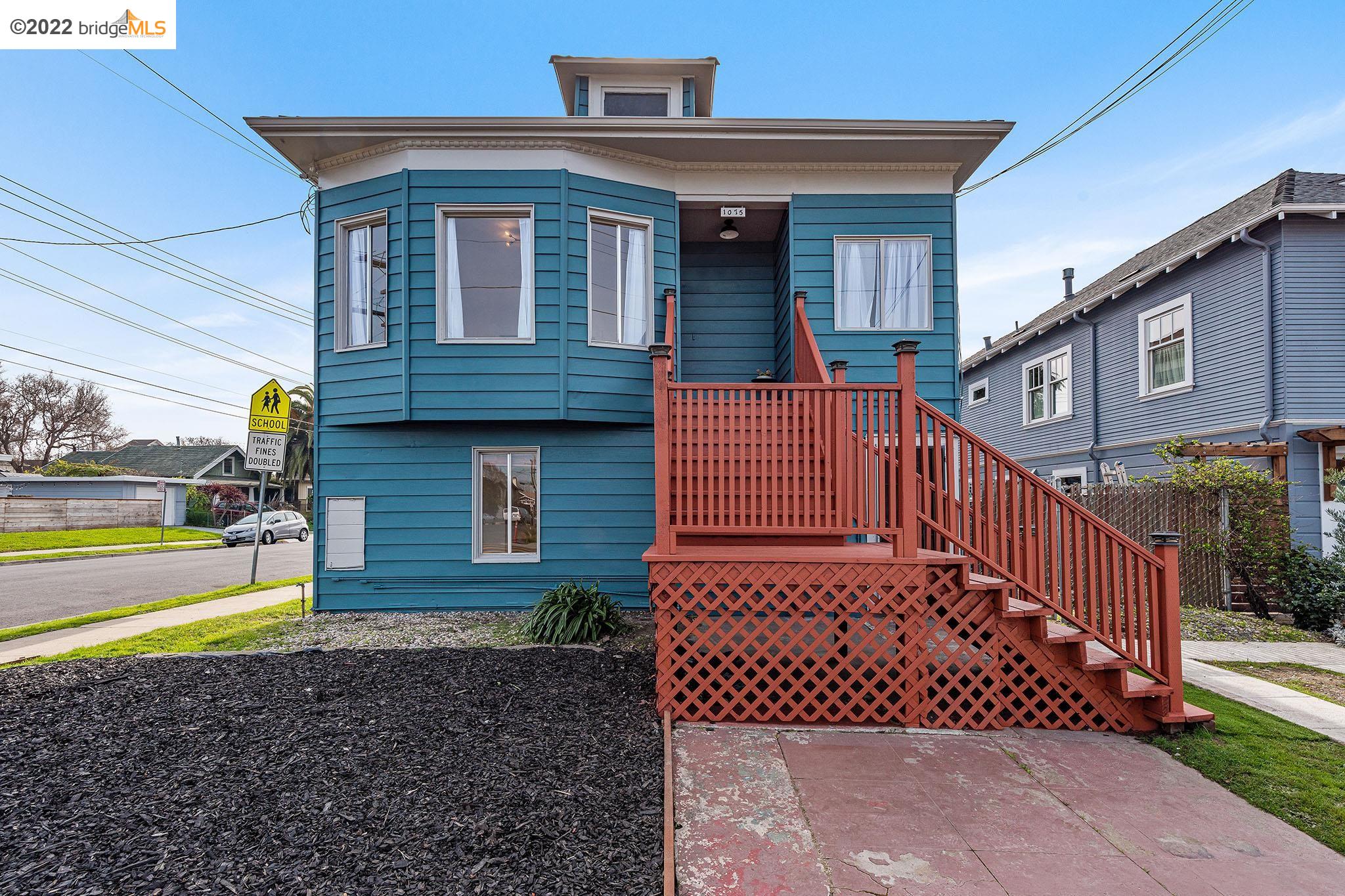 1075 65th Street Oakland, CA 94608 - Photo 1 of 1 a view of a house with a large window and wooden fence