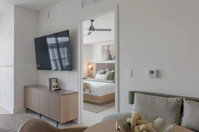 a bed room with a bed and a painting