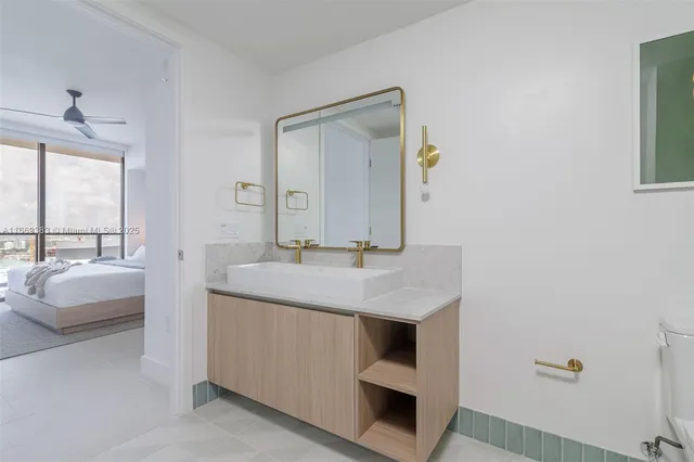 a lobby with furniture and floor to ceiling window