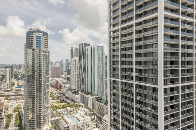 a lobby with gym equipment and a large window