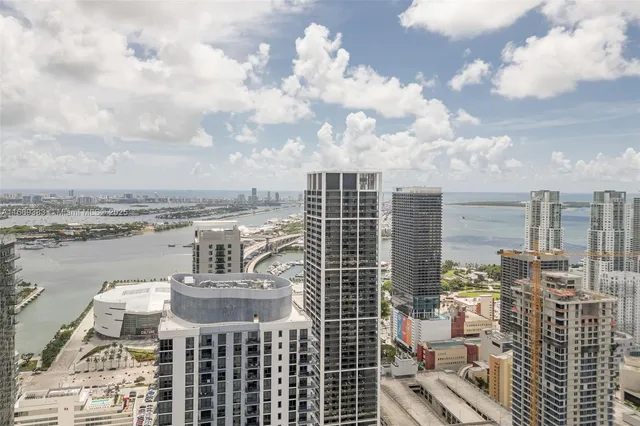 a view of a swimming pool with a garden and plants