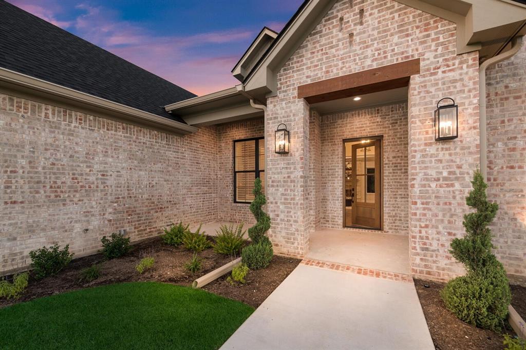 8005 Bee Cave Road China Spring, TX 76633 - Photo 3 of 40 a front view of a house with a garden
