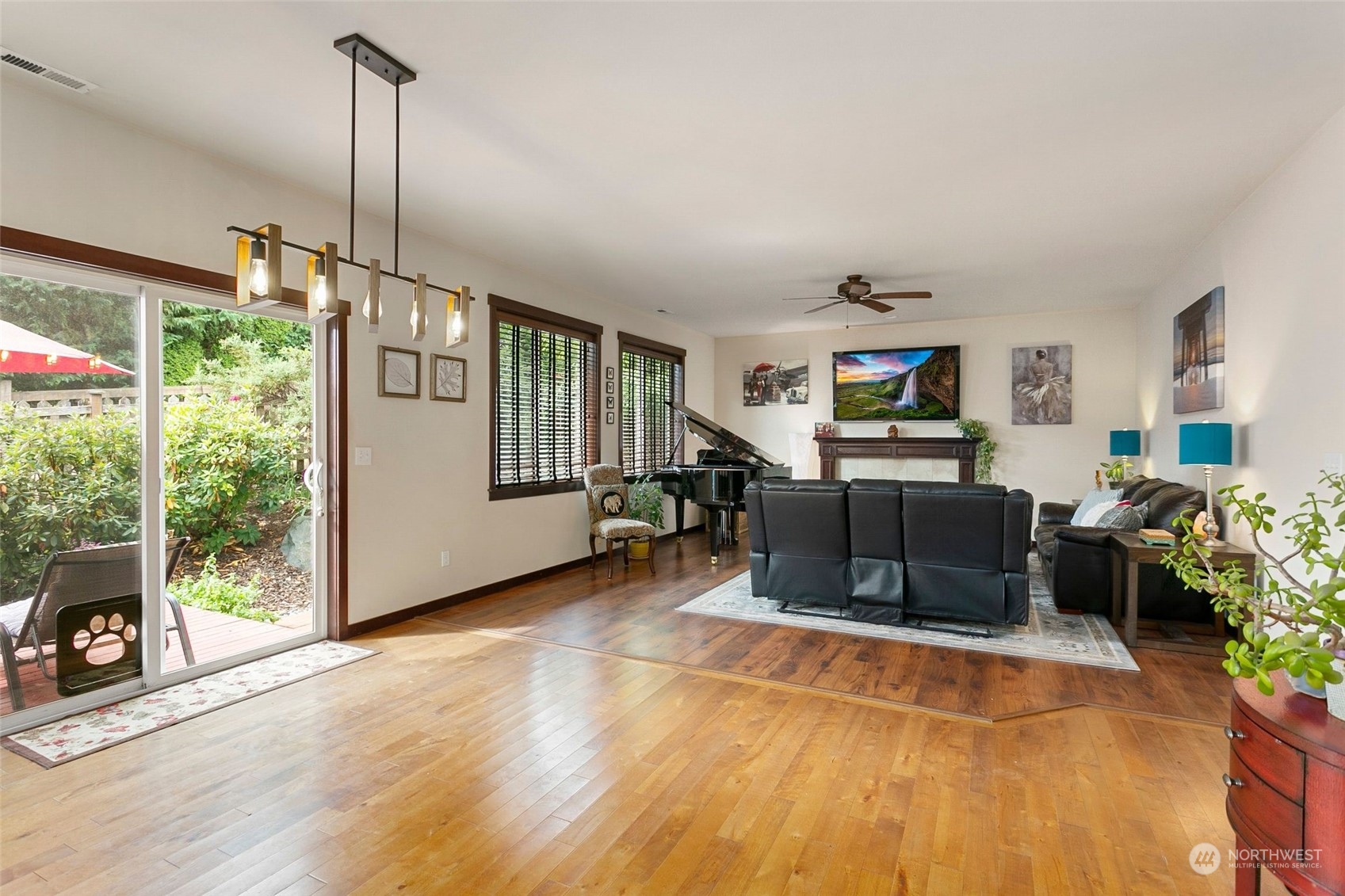 408 171st Street Southeast Bothell, WA 98012 - Photo 11 of 31 a living room with furniture a flat screen tv and a floor to ceiling window