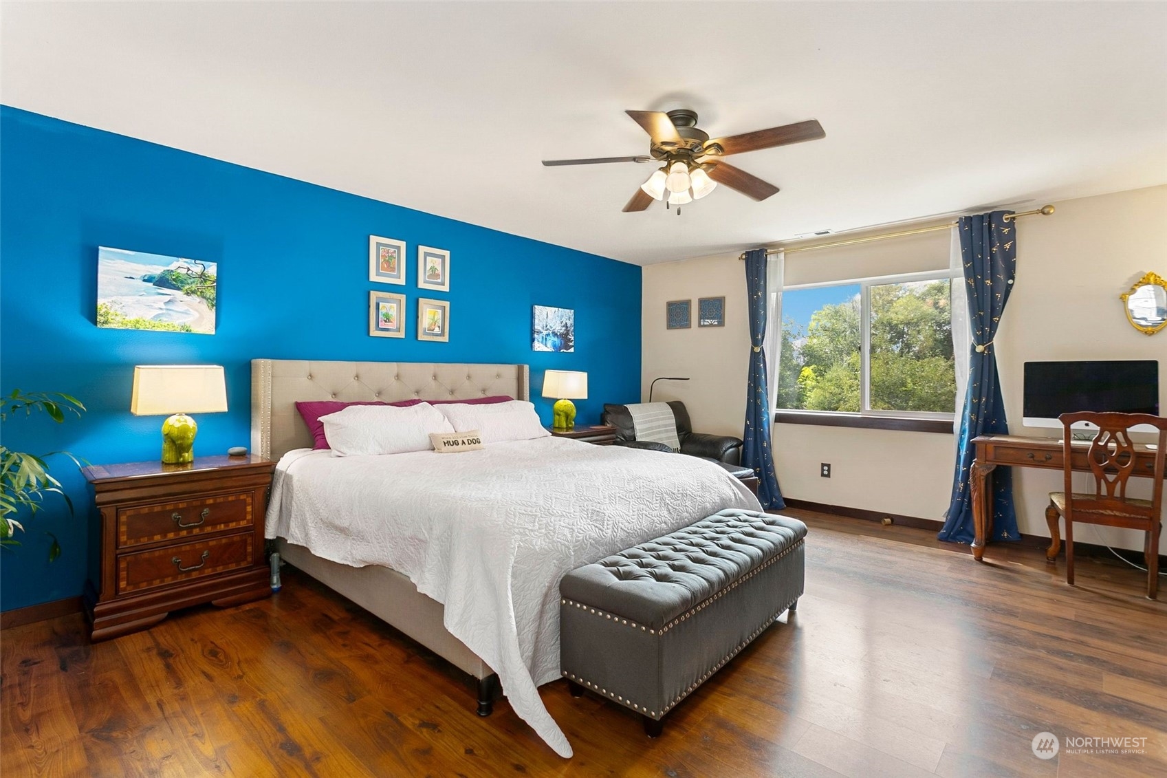 408 171st Street Southeast Bothell, WA 98012 - Photo 17 of 31 a spacious bedroom with a bed a couch and dresser