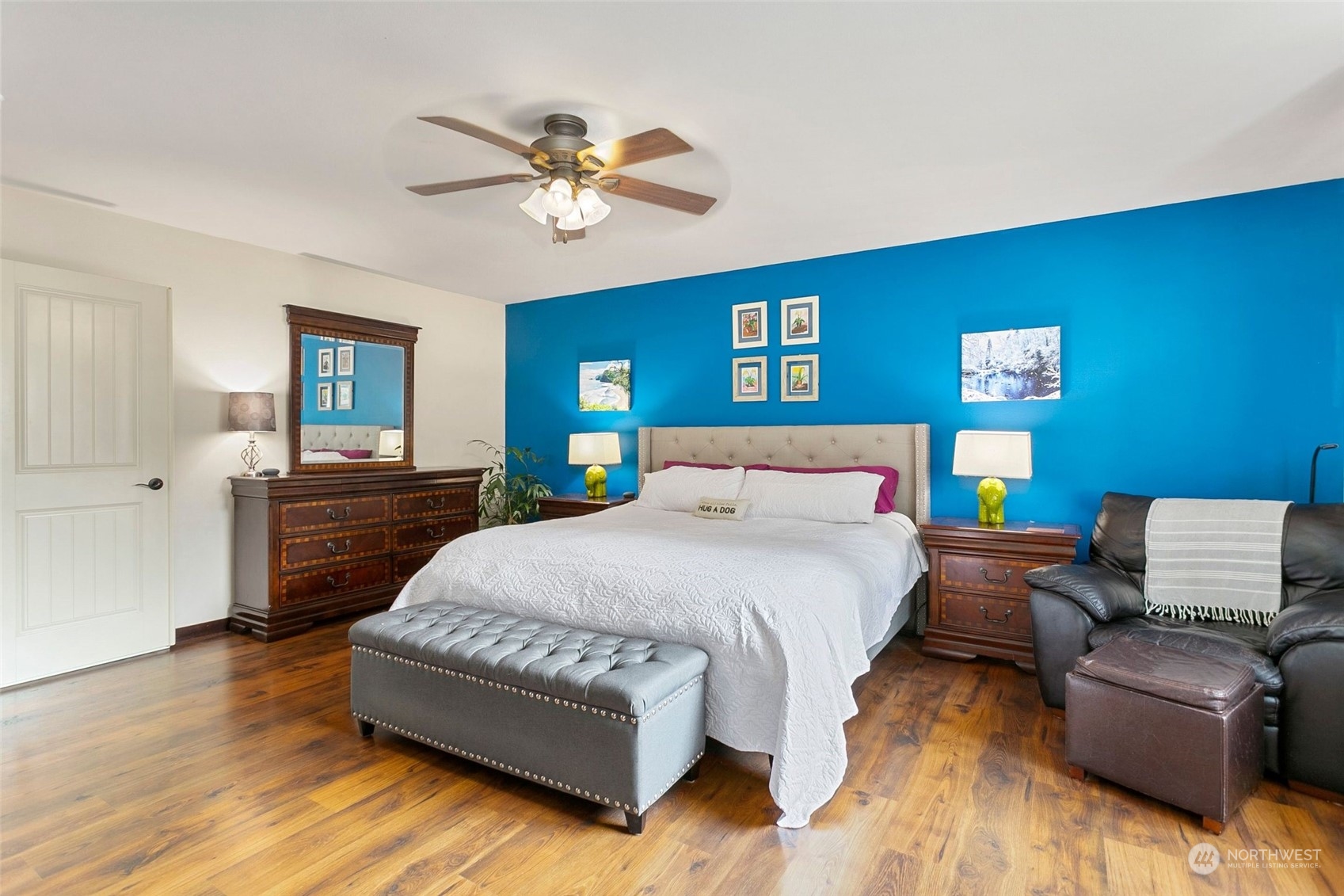 408 171st Street Southeast Bothell, WA 98012 - Photo 18 of 31 a bedroom with a bed and wooden floor