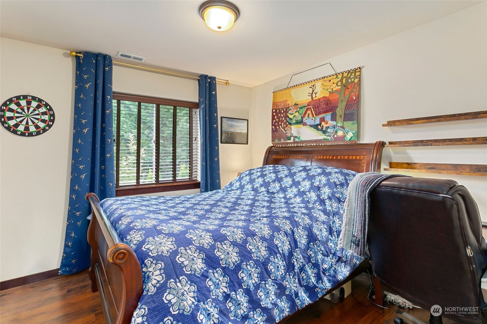 408 171st Street Southeast Bothell, WA 98012 - Photo 24 of 31 a bedroom with a bed and wooden floor