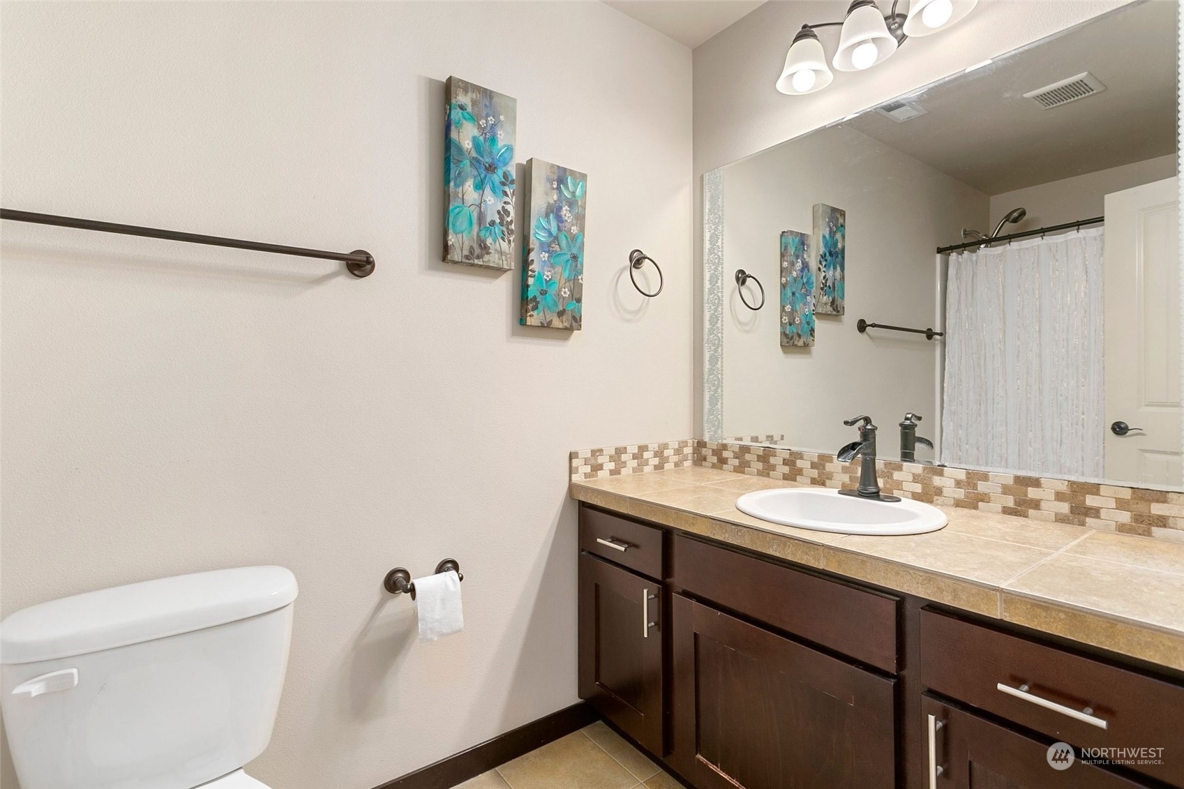 408 171st Street Southeast Bothell, WA 98012 - Photo 25 of 31 a bathroom with a granite countertop sink a toilet and a mirror