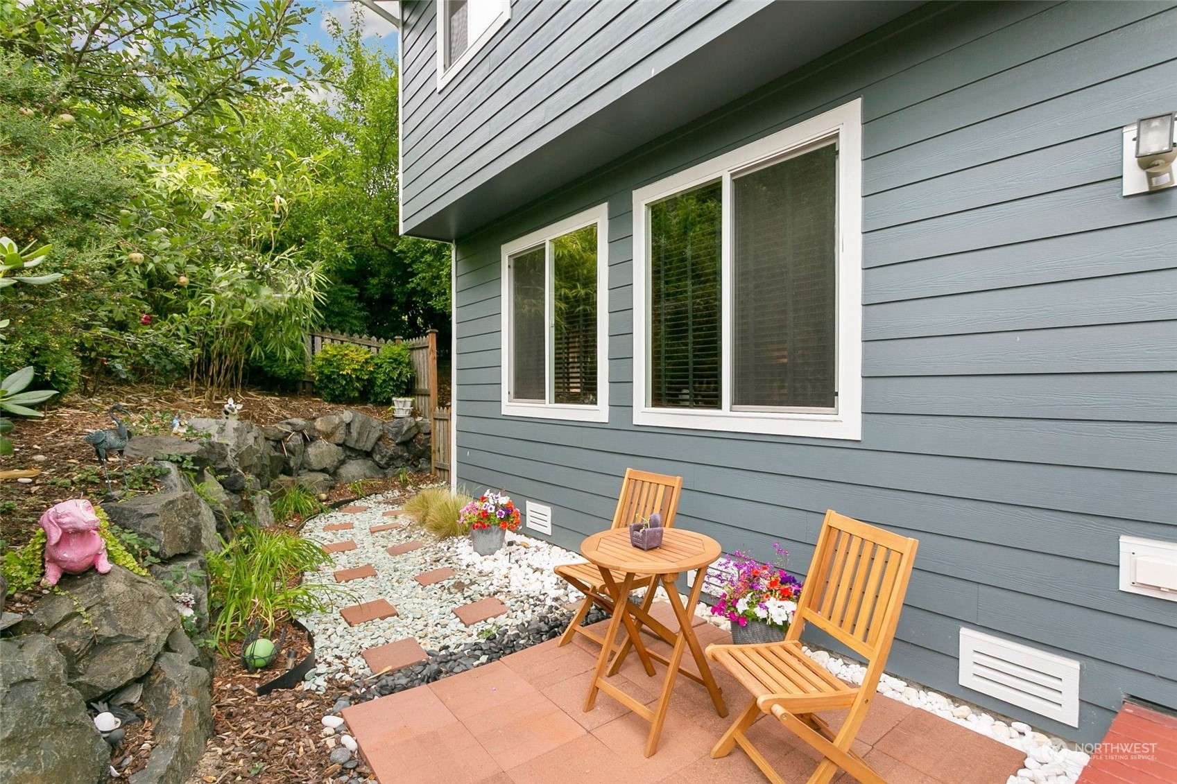 408 171st Street Southeast Bothell, WA 98012 - Photo 29 of 31 a view of a backyard with table and chairs and potted plants