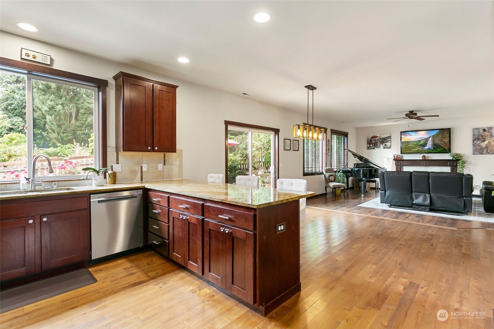 408 171st Street Southeast Bothell, WA 98012 - Photo 9 of 31 a kitchen with stainless steel appliances granite countertop a stove and a sink
