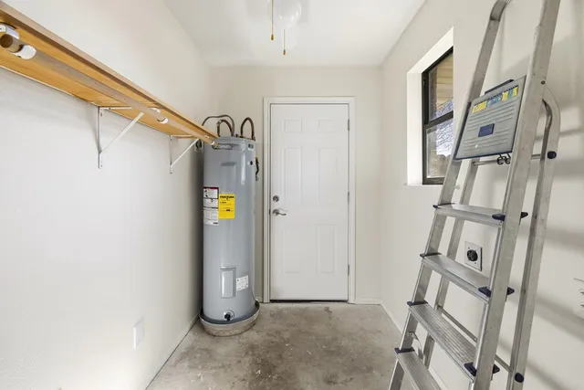 a view of an entryway with wooden floor and door