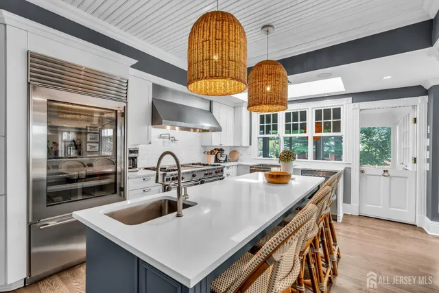 a bedroom with a large bed and a large window