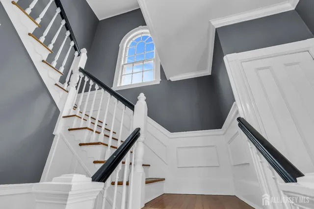 a living room with furniture fireplace and window