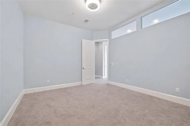 a bathroom with a double vanity sink toilet and a mirror