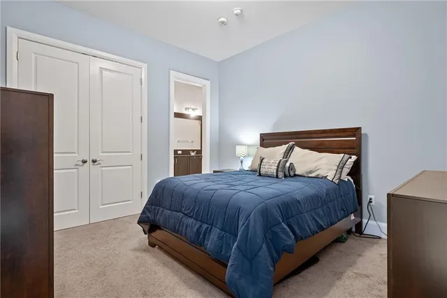 a bedroom with a bed and a television