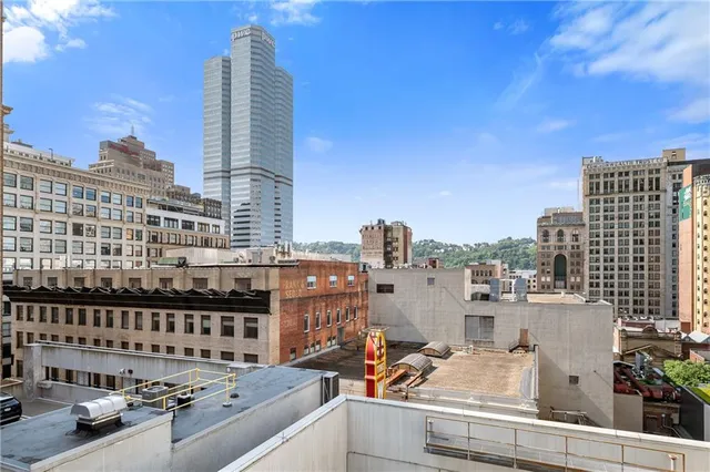 a view of city with tall buildings