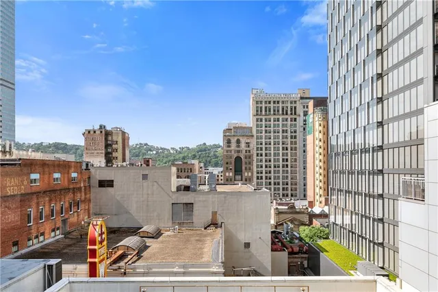 a view of city with tall buildings