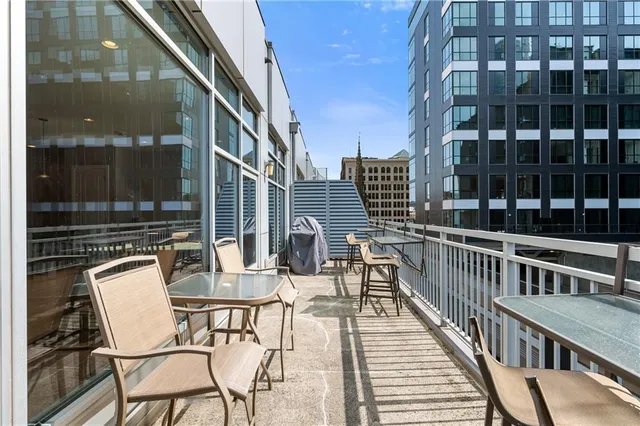 a view of a balcony with chairs