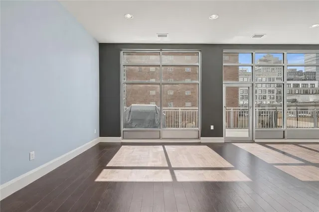 a open kitchen with stainless steel appliances granite countertop a stove a sink and a wooden cabinets