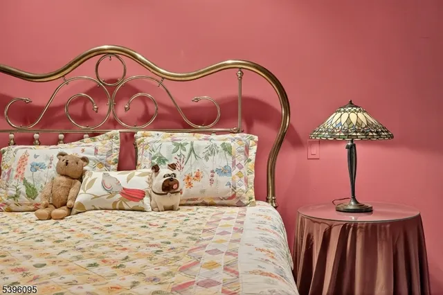 a bedroom with a bed and a table