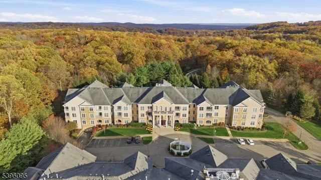a view of house with garden space and mountain view
