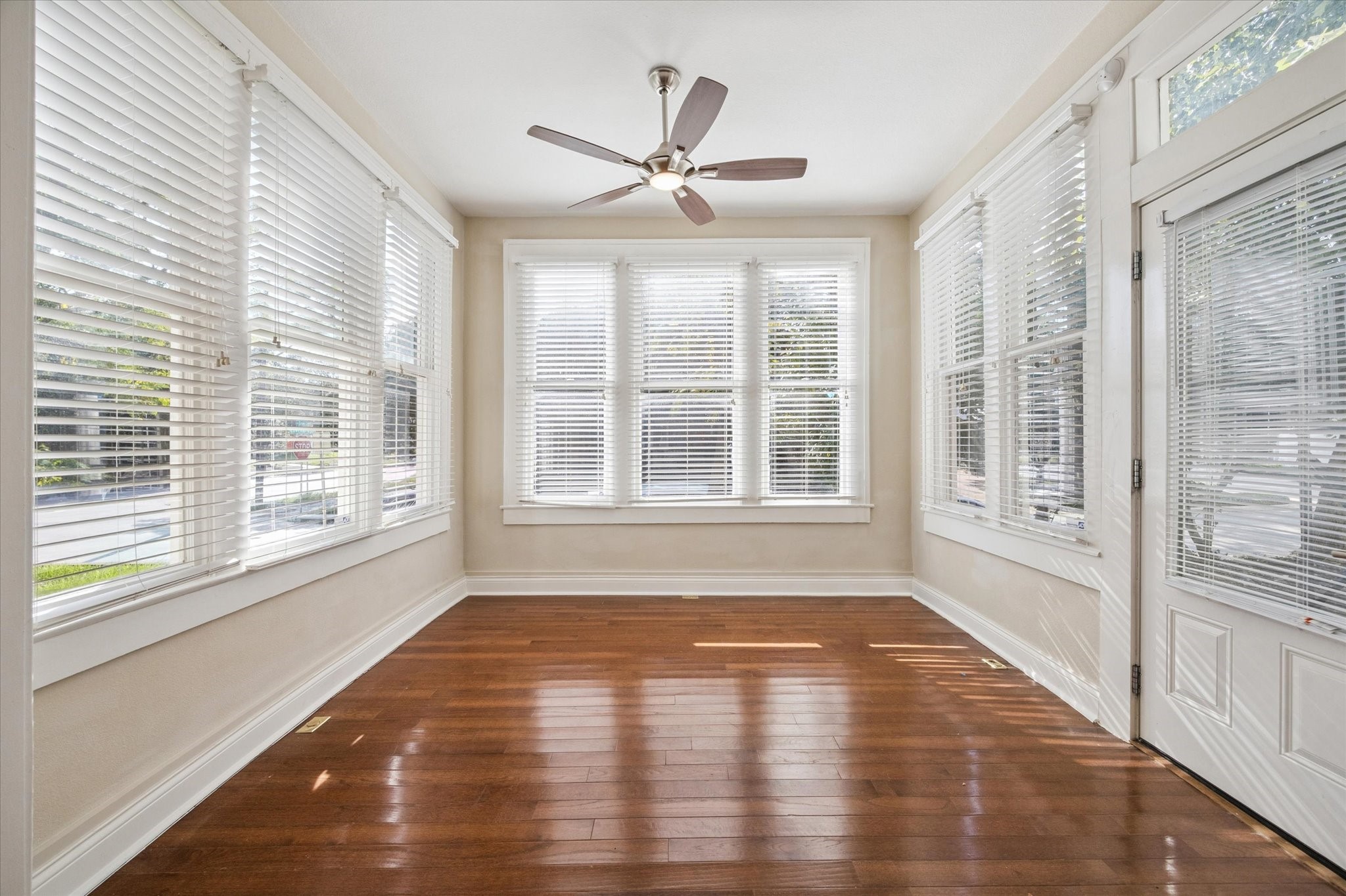 1220 West Gray Street Houston, TX 77019 - Photo 22 of 49 a view of empty room with wooden floor and fan