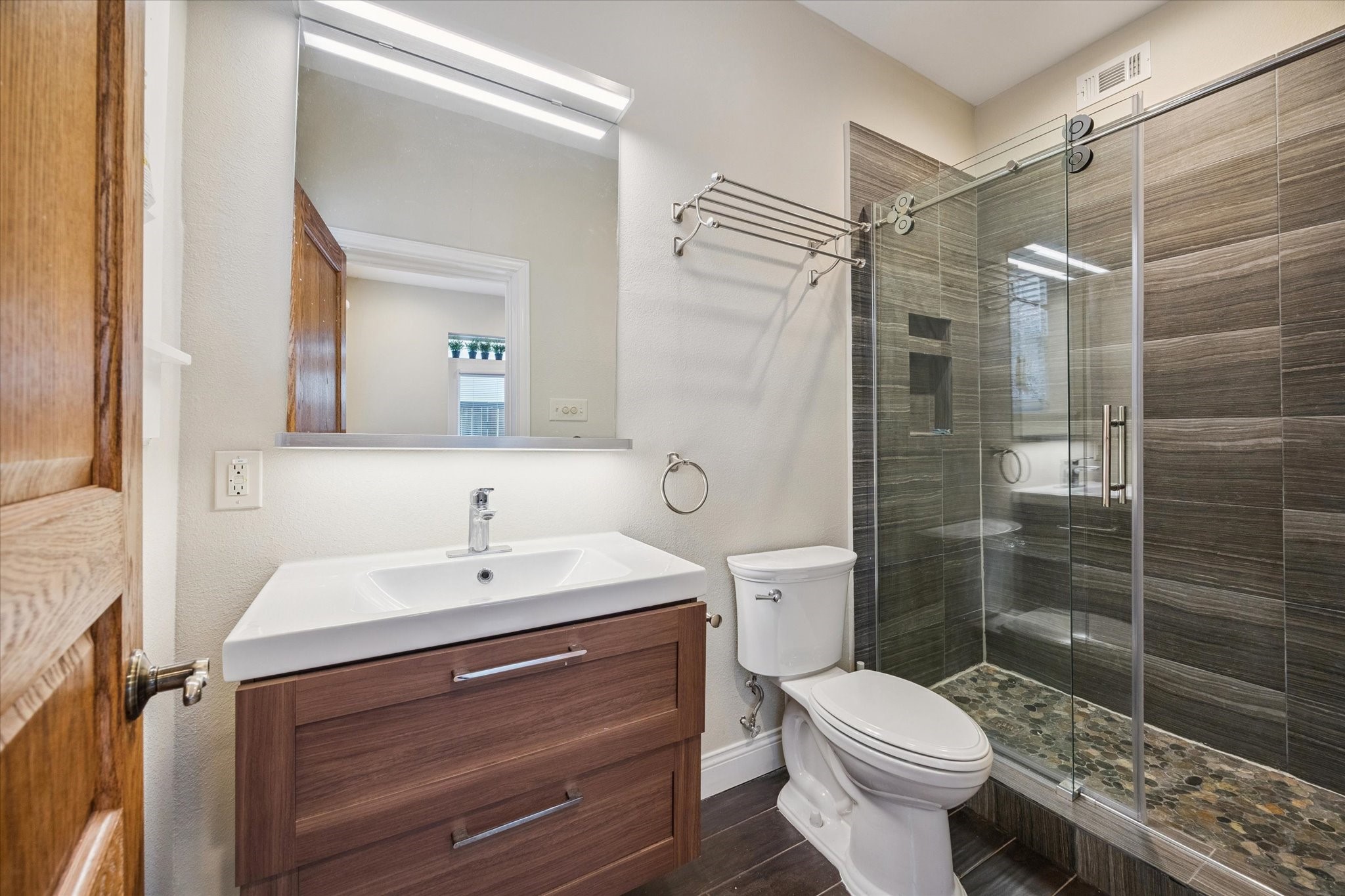 1220 West Gray Street Houston, TX 77019 - Photo 25 of 49 a bathroom with a sink toilet and shower