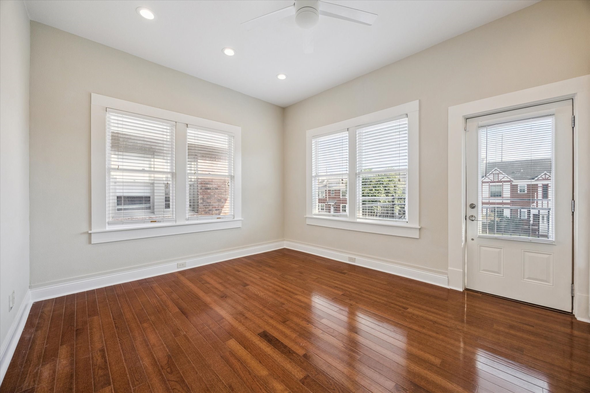 1220 West Gray Street Houston, TX 77019 - Photo 35 of 49 a view of an empty room with wooden floor and a window