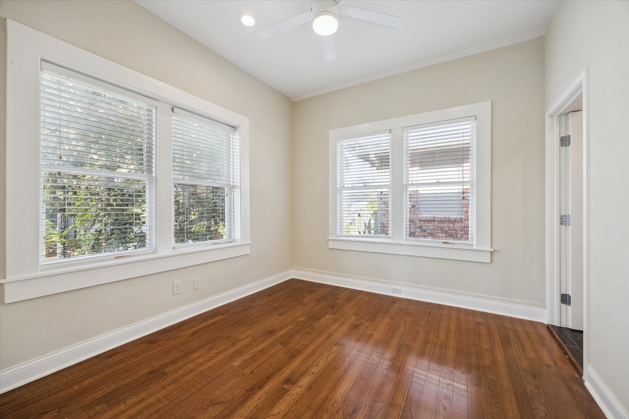 1220 West Gray Street Houston, TX 77019 - Photo 39 of 49 a view of an empty room with wooden floor and a window