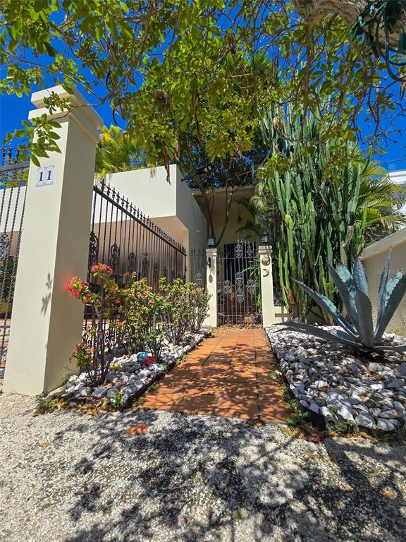 11 Bucare San Juan, PR 00913 - Photo 1 of 1 a view of a house with a tree and flower plants
