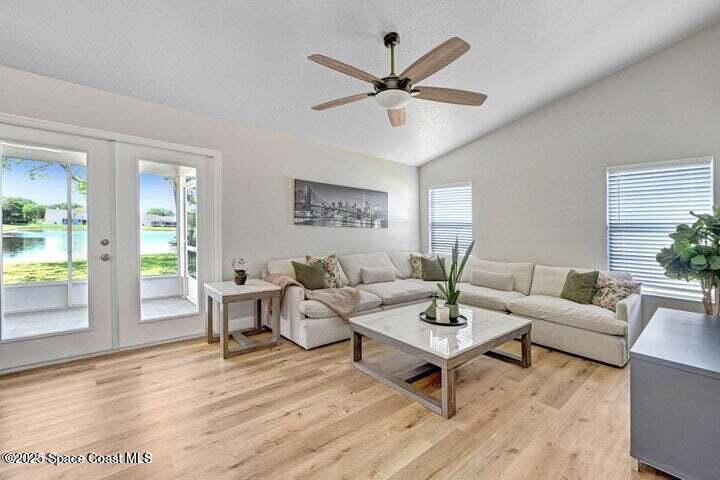 3360 Holly Springs Road Melbourne, FL 32934 - Photo 12 of 30 a living room with furniture a window and a table