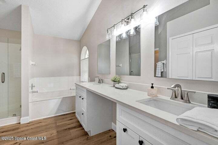 3360 Holly Springs Road Melbourne, FL 32934 - Photo 16 of 30 a bathroom with a sink vanity granite tub and a mirror