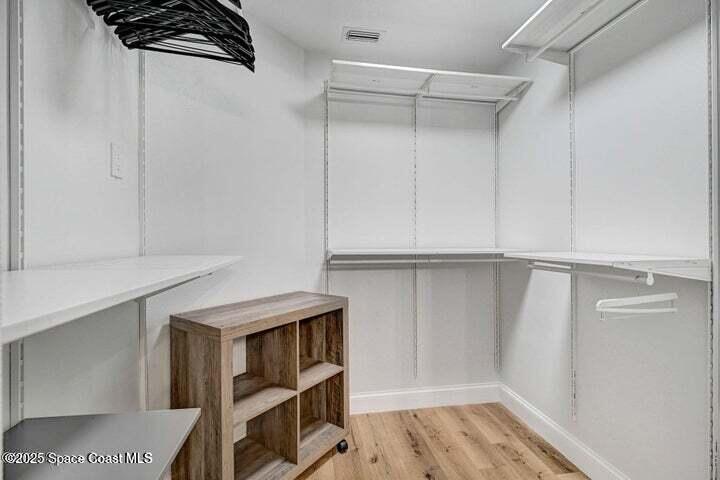 3360 Holly Springs Road Melbourne, FL 32934 - Photo 18 of 30 a view of walk in closet with empty racks