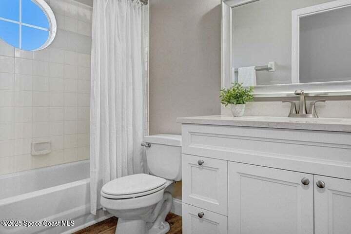 3360 Holly Springs Road Melbourne, FL 32934 - Photo 20 of 30 a bathroom with a sink toilet and shower