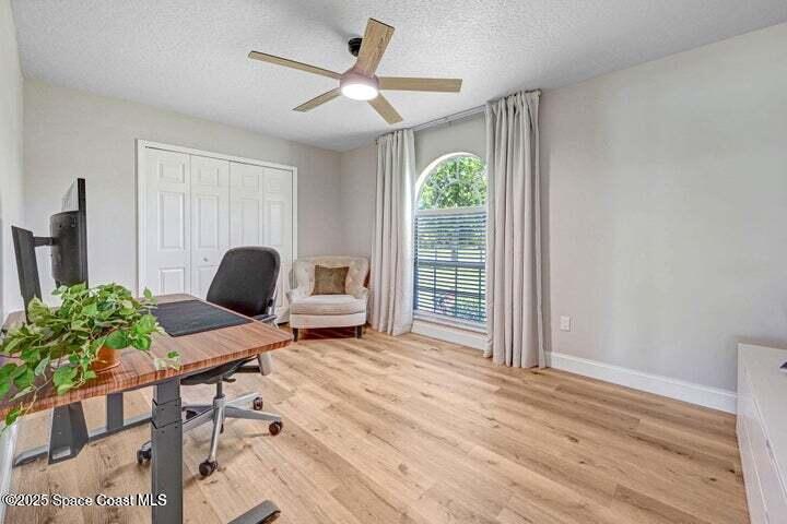 3360 Holly Springs Road Melbourne, FL 32934 - Photo 21 of 30 a workspace with furniture and a window