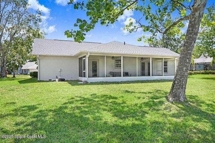3360 Holly Springs Road Melbourne, FL 32934 - Photo 22 of 30 a view of a house with a yard
