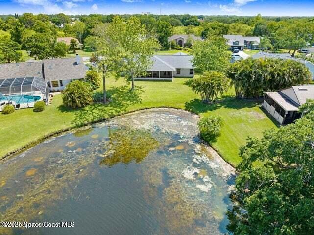 3360 Holly Springs Road Melbourne, FL 32934 - Photo 26 of 30 a aerial view of a house with a yard basket ball court and outdoor seating